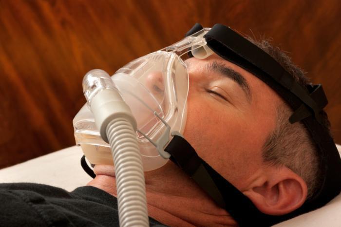 man-using-cpap